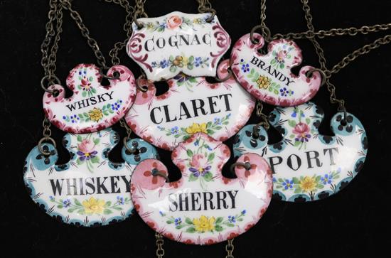 Seven enamelled wine labels